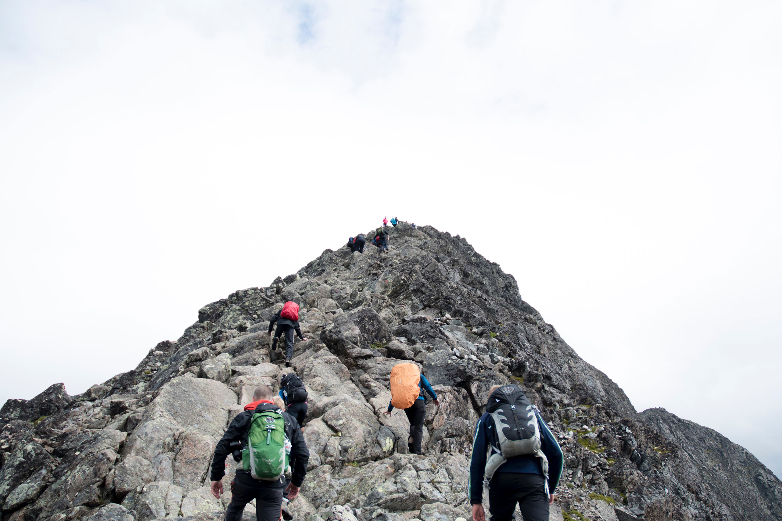 Men climbing a mountain