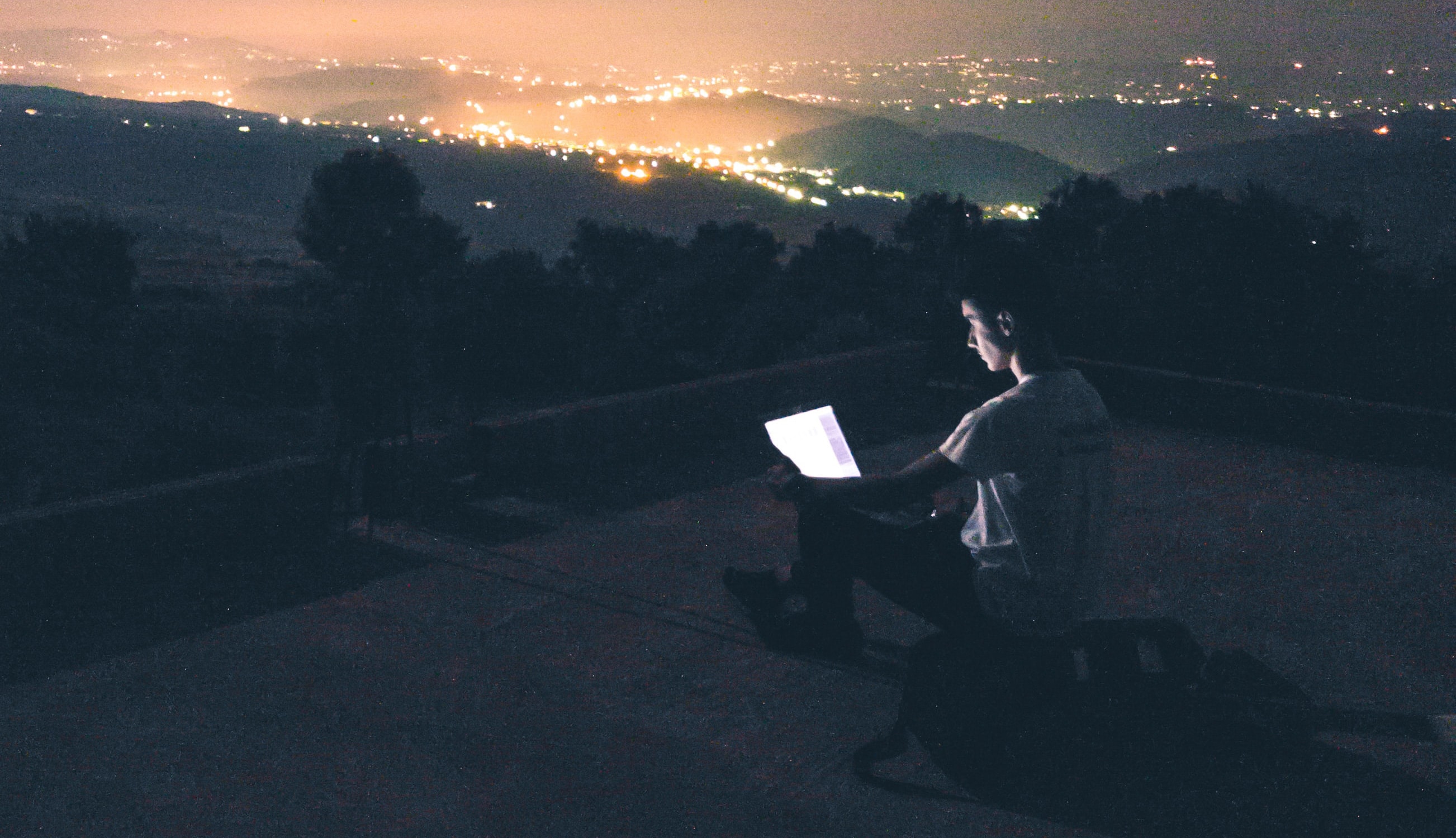 How to be a successful remote web designer || man on laptop overlooking city skyline