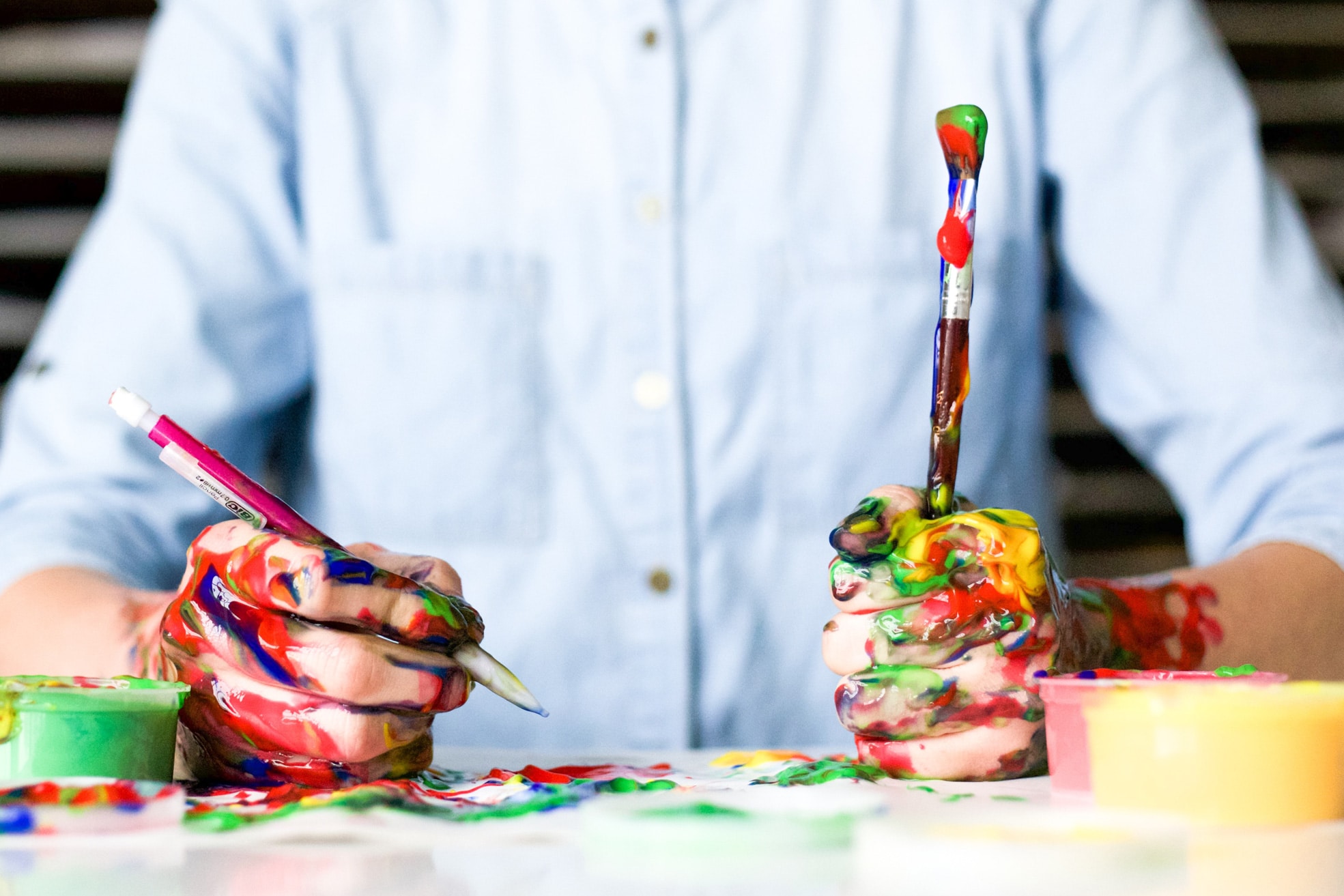 How to Be More Creative as a Web Designer || A man with paint on his hands to express creativity