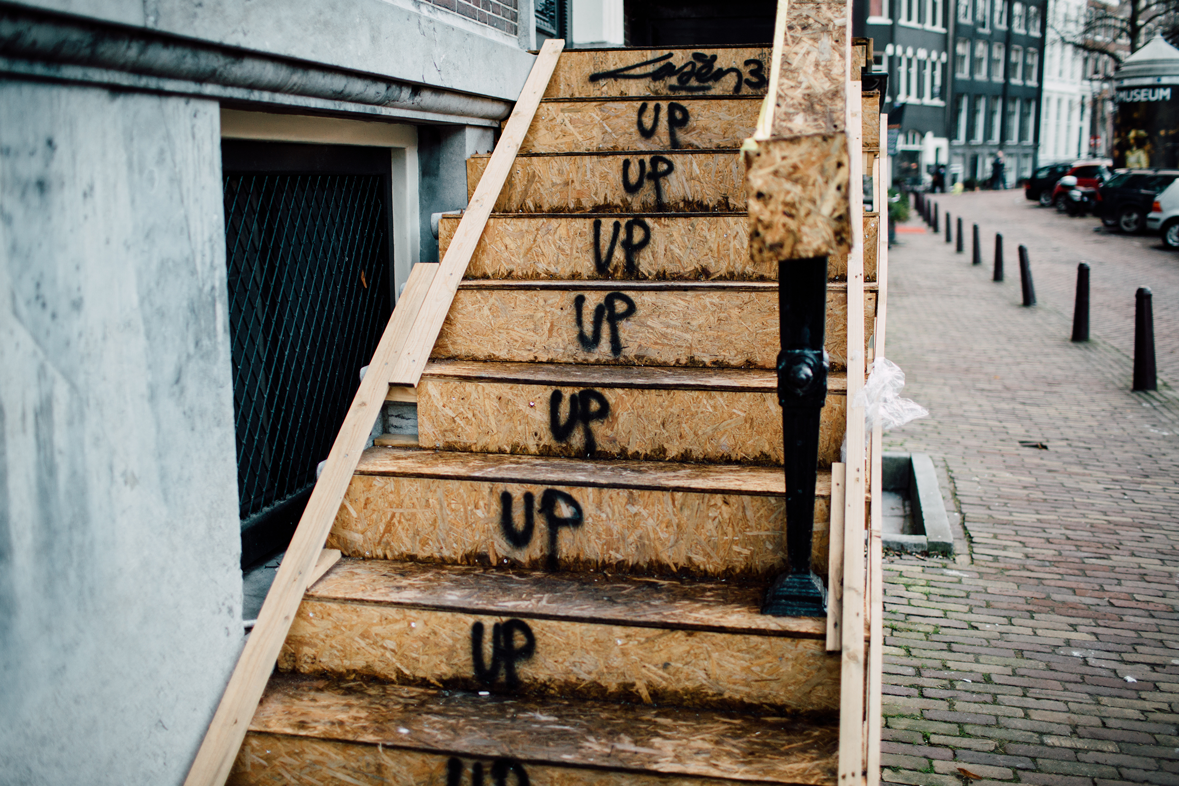 Wooden steps with "Up" spray painted on each