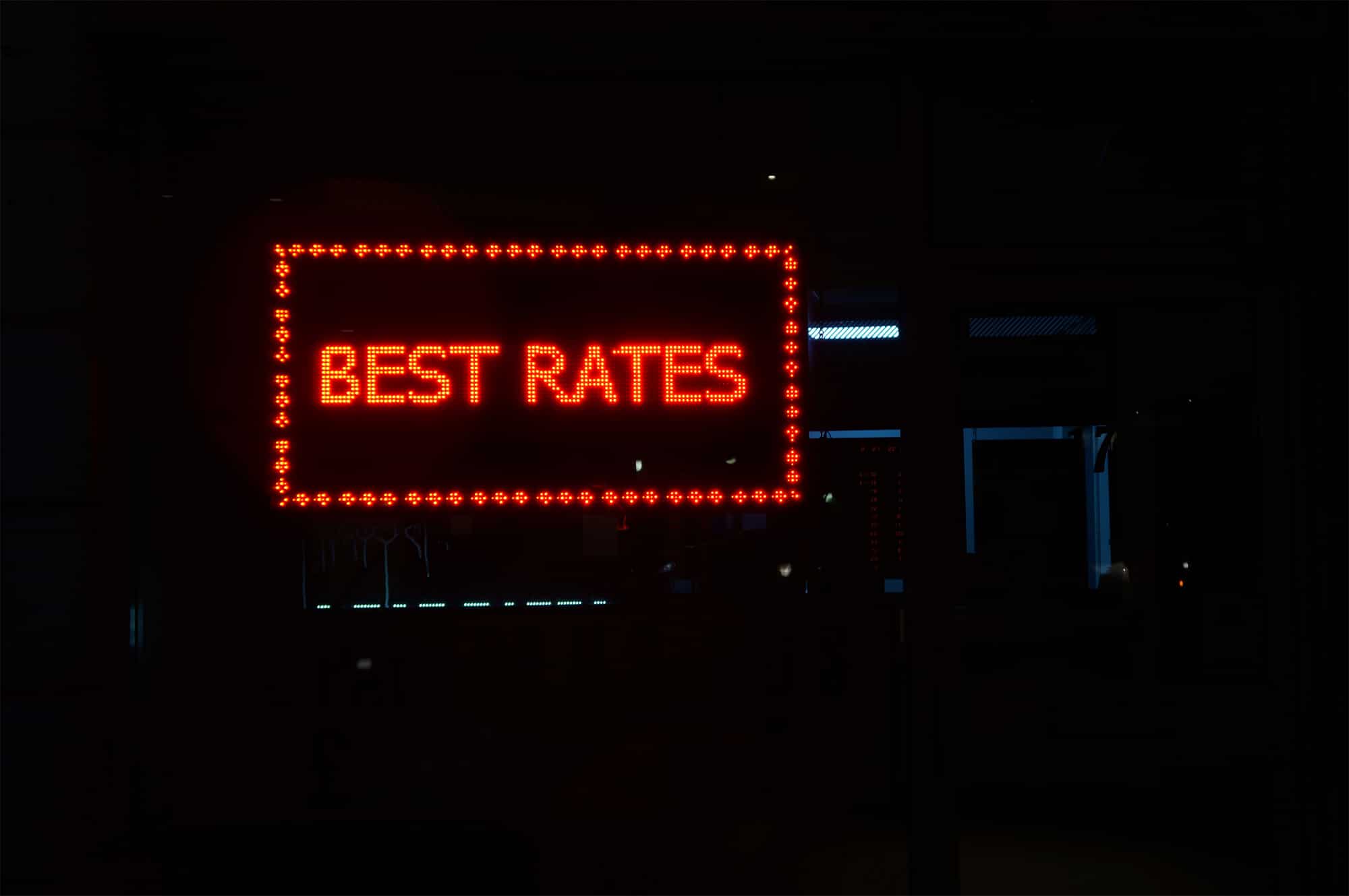 How to price your services as a freelance web designer|| A sign at a hotel that says "Best Rates"