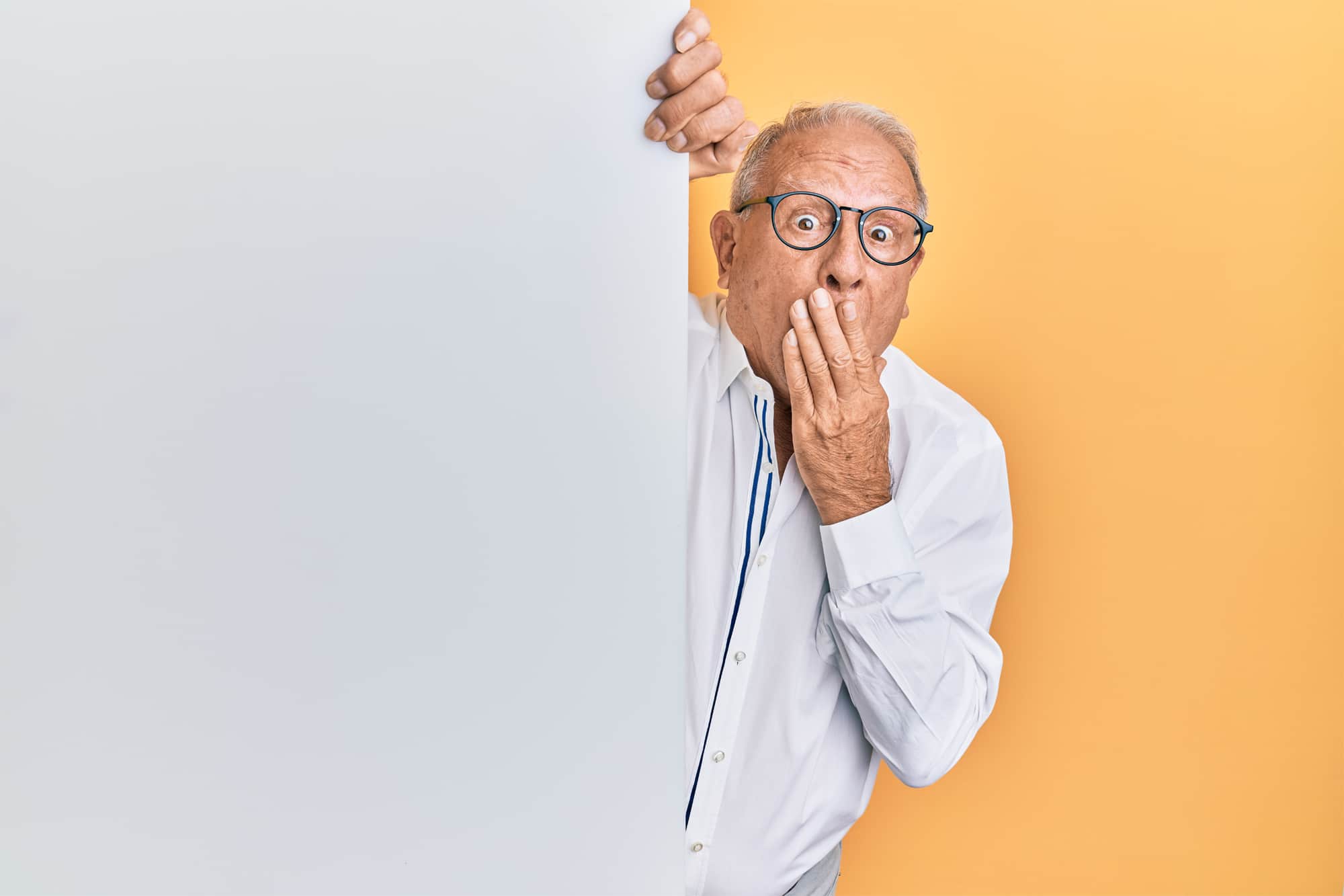 Old man with a "whoops" face to illustrate mistakes with freelance clients