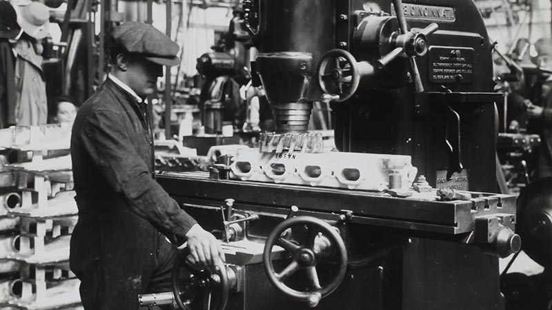 a worker on a manufacturing line to illustrate a web designer productizing their services