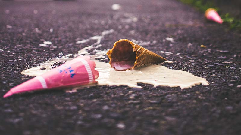a broken ice cream on the ground