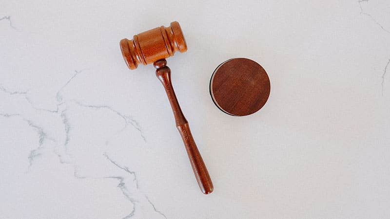 a judge's gavel to symbolize the importance of web design contracts