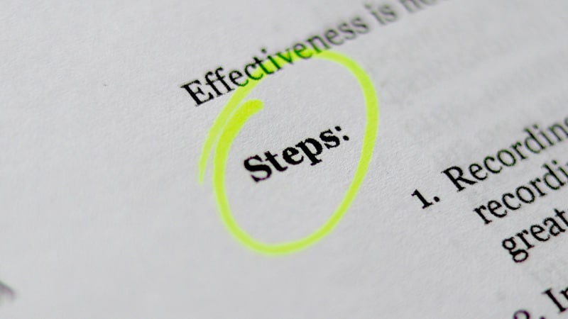 a book page with the word "steps" highlighted to emphasize creating steps in a web design process
